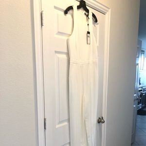 Women’s off white jumpsuit. With cut outs
